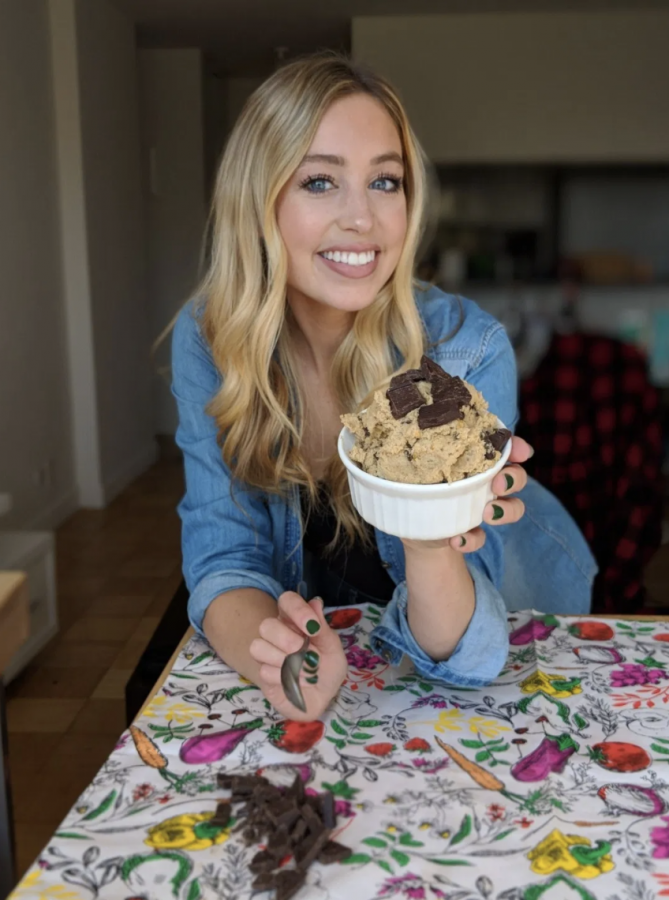  An image of Skyler Bouchard with one of her special chocolate desserts, Skinny Chickpea Edible Cookie Dough! 