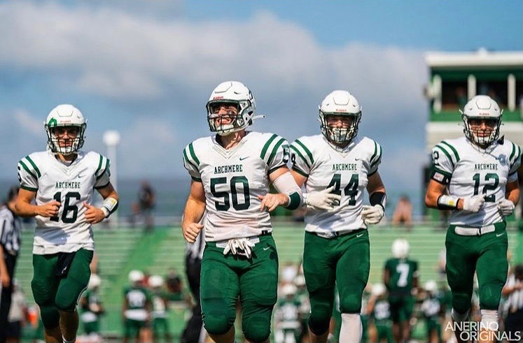Archmere+Football+Captains+Chris+Albero%2C+Kevin+DeGregorio%2C+Kieran+Udovich%2C+and+Conor+Udovich+return+from+the+opening+coin+toss.+%0APhoto+by+Mr.+Chuck+Anerino+%28P23%29
