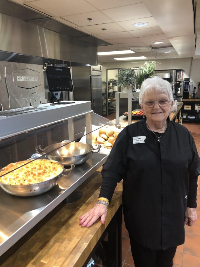 Ms.+Anne+Wisgo+prepares+to+welcome+students+to+Sages+annual+Thanksgiving+feast.+Ms.+Anne+has+worked+at+Archmere+for+eight+years%2C+and+she+is+well+known+for+her+warm+greetings+for+the+students.