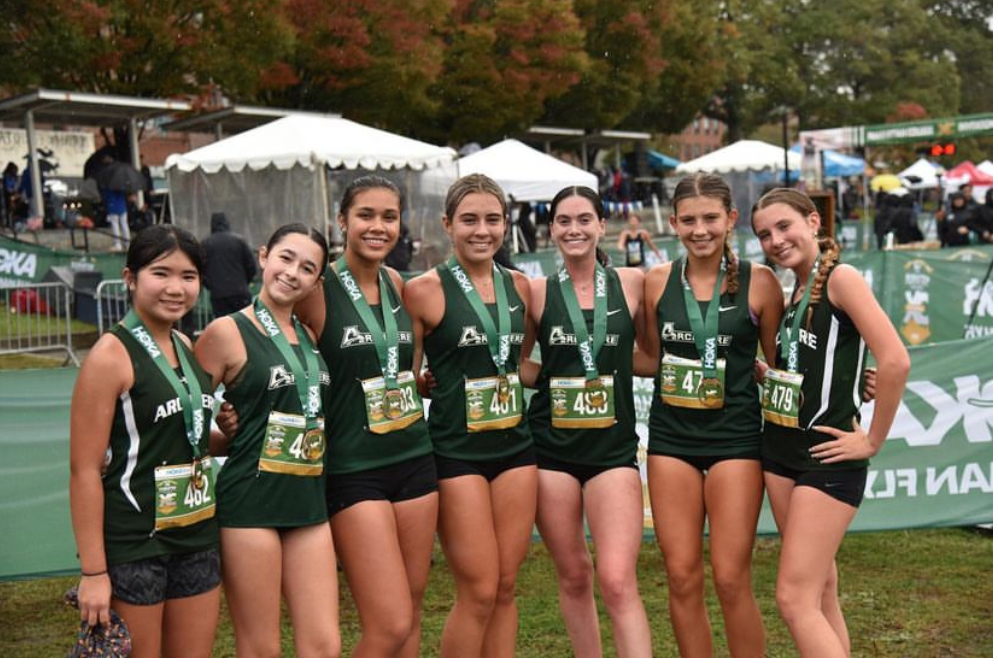 +The+JV+girls+cross+country+team+smile+after+a+great+race+in+Manhattan.